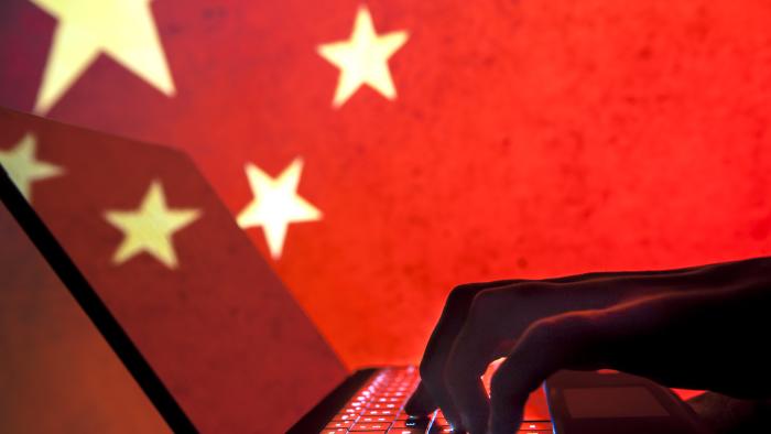 Cybercriminal, hacker China flag background.